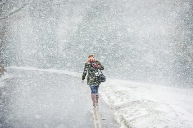 Woman walking in snow storm