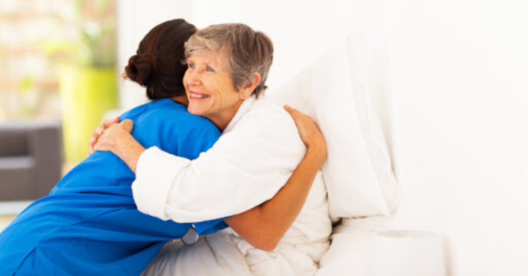 Nurse hugging patient