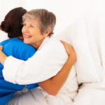Nurse hugging patient