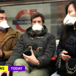People wearing masks on tube