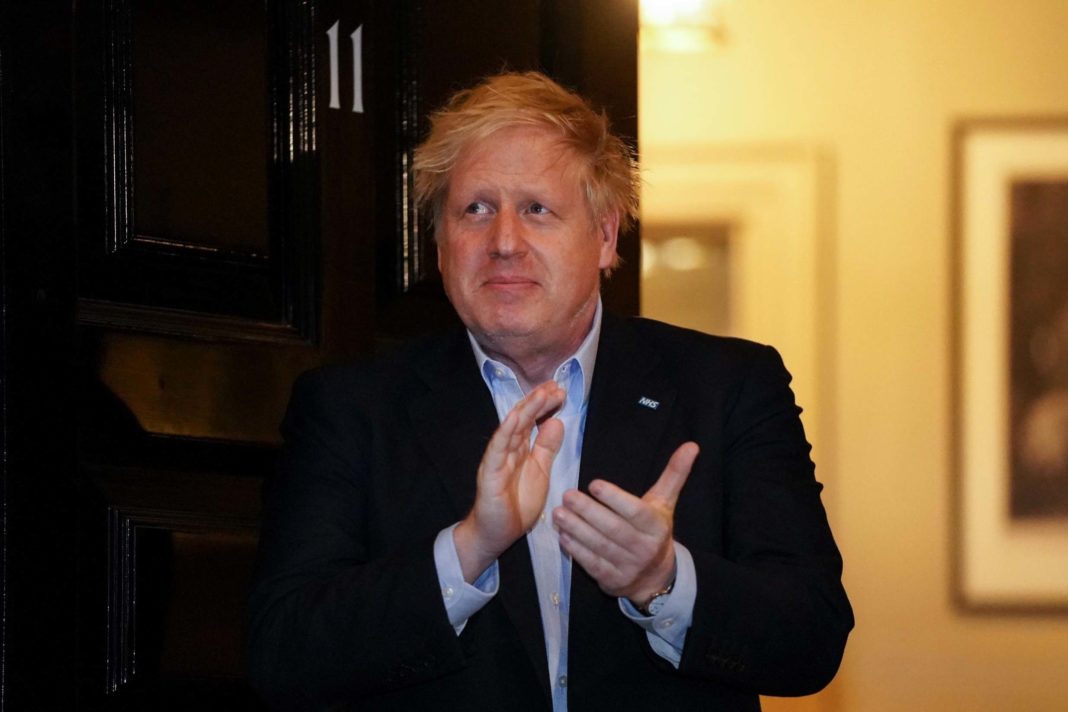 Boris Johnson claps for carers