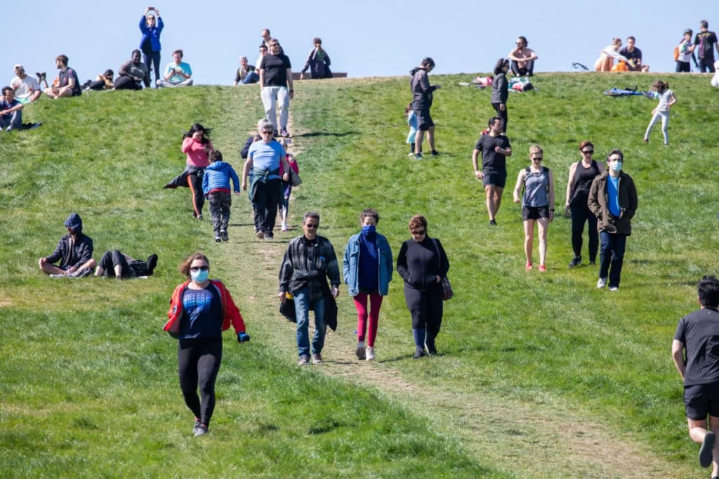 People on grass hill