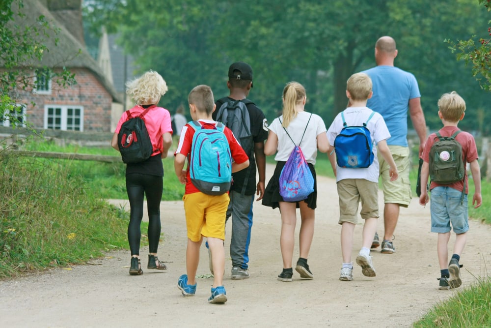 Parents walking kids to school