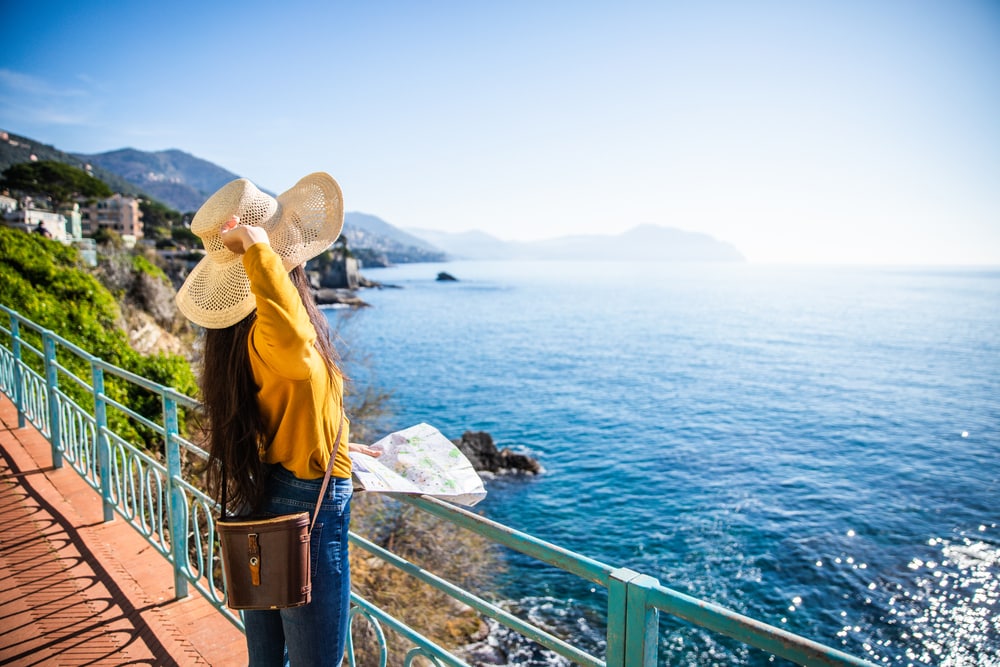 Holiday maker looking at sunny view