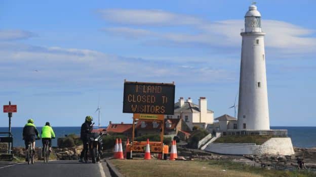 White lighthouse on island