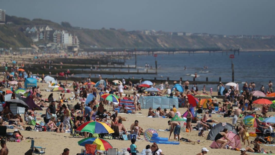 Thousands of People Flock To Beaches on Hottest Day of The Year