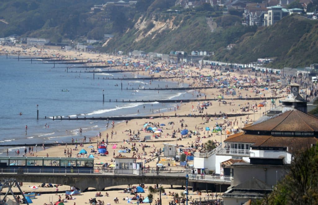 Thousands of People Flock To Beaches on Hottest Day of The Year