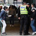 Police telling man off