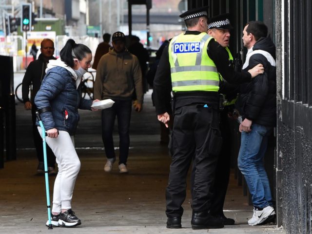 Police telling man off during lockdown