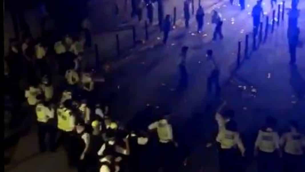 22 police officers injured and cars smashed after Brixton street party