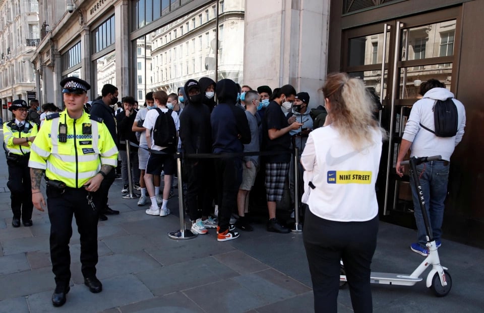 Queues form outside shops as England eases lockdown