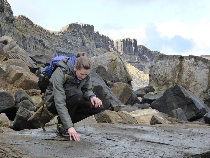 Scientist finds dinosaur bone while running on Scottish island