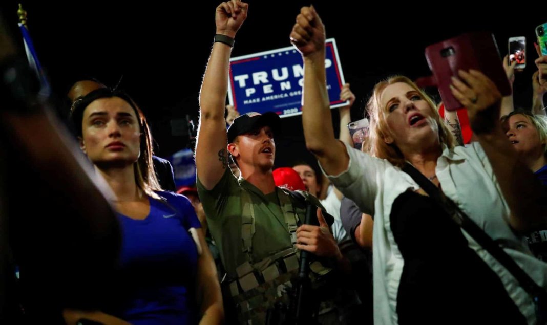 Trump supporters, some armed with rifles, outside vote counting centres